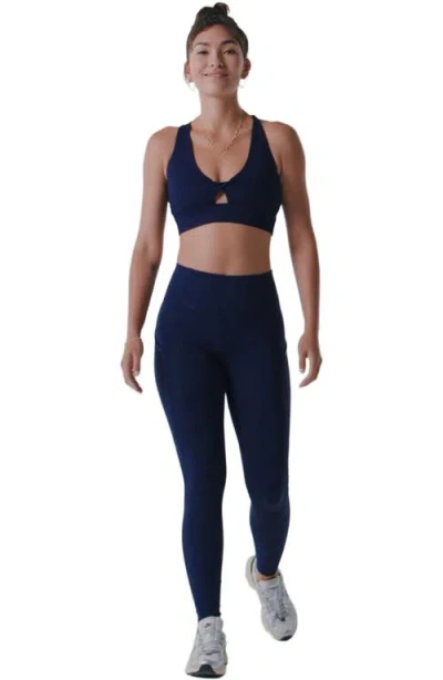 Fabletics Oasis Twist Medium Impact Sports Bra In Blue