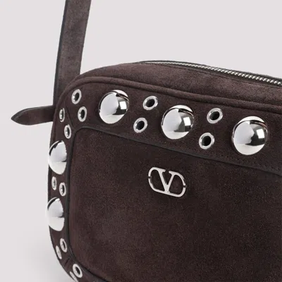 Valentino Garavani Dome-shaped Crossbody Bag With Metallic Eyelets And Adjustable Strap In Brown