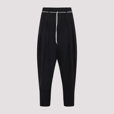 Mordecai Tapered Black Trousers With Pleated Front In Black
