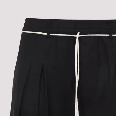 Mordecai Tapered Black Trousers With Pleated Front In Black