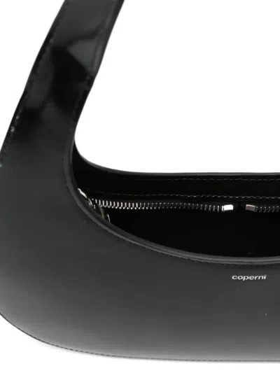 Coperni Curved Glossy Top Handle Bag In Black