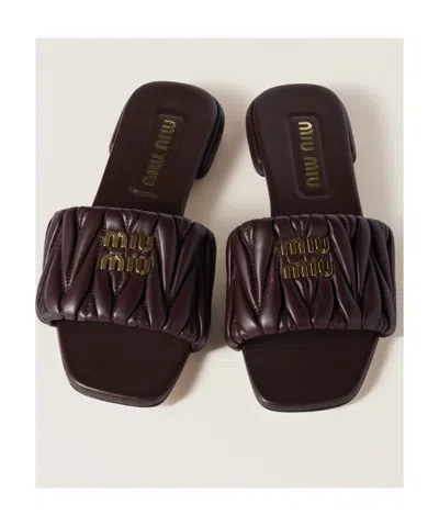 Miu Miu Matelassé Nappa Leather Slides In Black