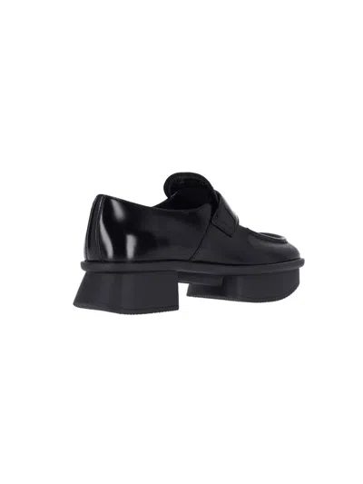 Prada Re-edition Equal Platform Penny Loafer In Black