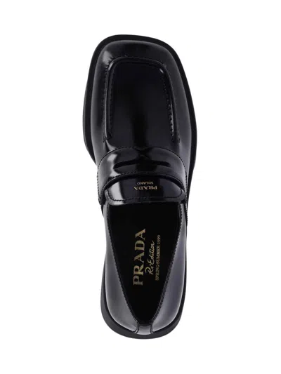 Prada Re-edition Equal Platform Penny Loafer In Black