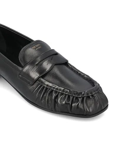 Prada Rounded Toe Loafers With Textured Detailing And Low Block Heel In Black