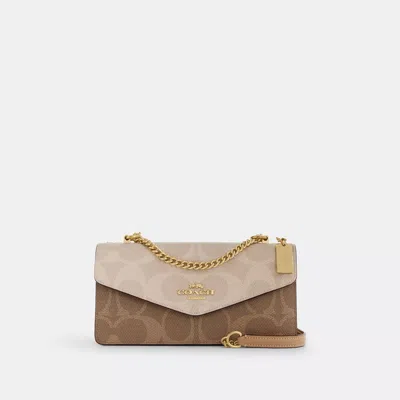 Coach Klare Envelope Crossbody Bag In Blocked Signature Canvas In Sand