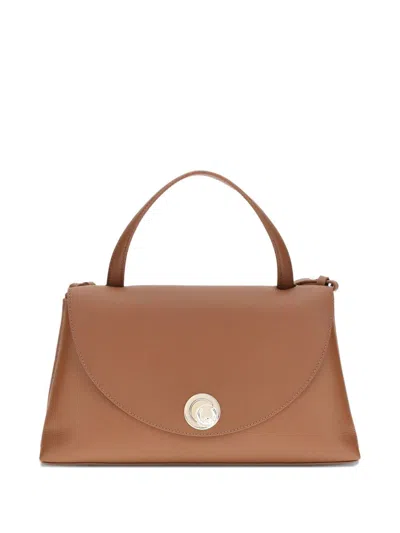 Coccinelle Curved Top Handbag With Circular Detail And Detachable Shoulder Strap In Brown