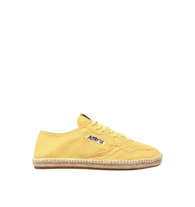 Autry Low Canvas Sneakers Espadrille Sole In Gold