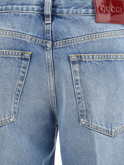Gucci Blue Jeans With Logo Patch On The Rear And Faded Effect In Denim Woman