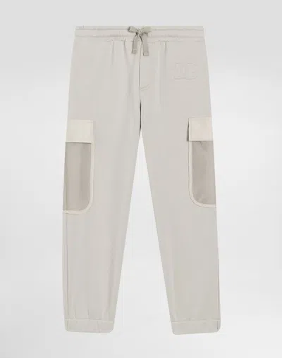 Dolce & Gabbana Dg Embossed Logo Fleece Trousers In Gray