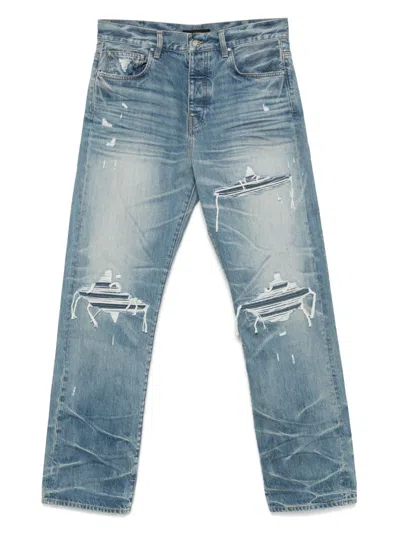 Amiri Men Blue Jeans With Ripped Details On The Front And Logo Patch On The Rear In Denim Man In Blue