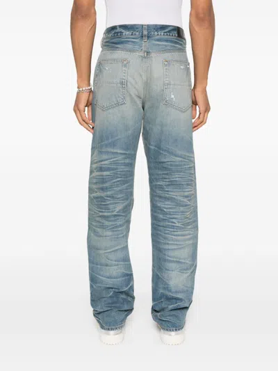 Amiri Men Blue Jeans With Ripped Details On The Front And Logo Patch On The Rear In Denim Man In Blue