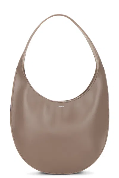Coperni Medium Curved Shoulder Bag With Top Handle In Brown