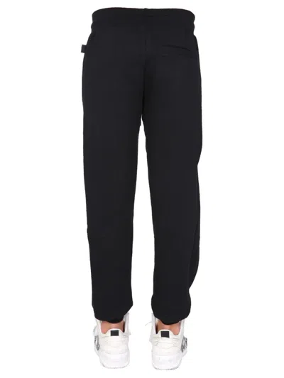 Gcds Jogging Pants With Cute Tape Logo Band In Black
