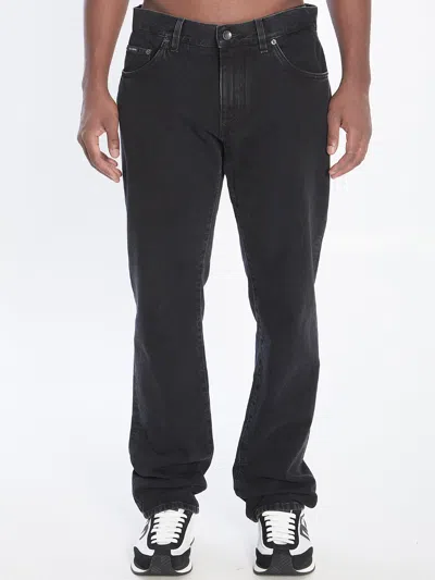 Dolce & Gabbana Denim Pants With Plaque In Black