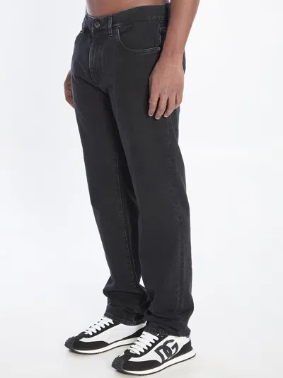 Dolce & Gabbana Denim Pants With Plaque In Black
