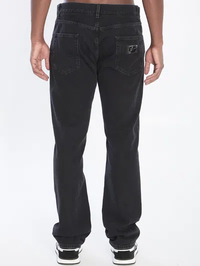 Dolce & Gabbana Denim Pants With Plaque In Black