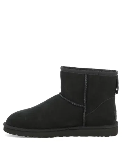 Ugg 'classic Mini' Black Ankle Boots With Logo Patch On The Rear And Shearling Lining In Suede Man In Black
