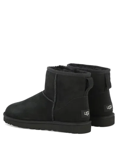 Ugg 'classic Mini' Black Ankle Boots With Logo Patch On The Rear And Shearling Lining In Suede Man In Black