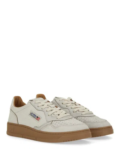 Autry Low Top Leather Sneakers With Perforated Round Toe In White