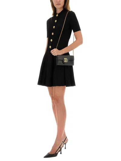 Balmain Textured Ribbed Knitted Cardigan With Button-up Front In Black