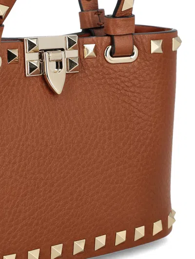 Valentino Mini Rockstud Embellished Tote Bag In Brown