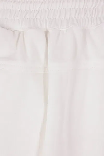 Hed Mayner Elasticated-cuff Pleated Trousers In Neutral