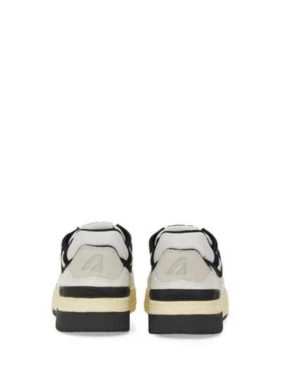 Autry White Low Top Sneakers With Black Details And Logo Patch In Leather And Suede Man