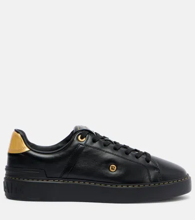 Balmain Sneakers 'court' Gold-tone Detail In Black