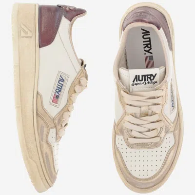 Autry Super Vintage Distressed Paneled Metallic Leather Sneakers In White