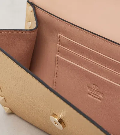 Valentino Garavani Rockstud Small Leather Shoulder Bag In Gold