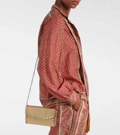 Valentino Garavani Rockstud Small Leather Shoulder Bag In Gold