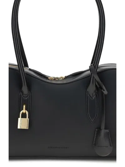 Stella Mccartney Stella Ryder Logo-embossed Embellished Textured Vegan Leather Tote In Black