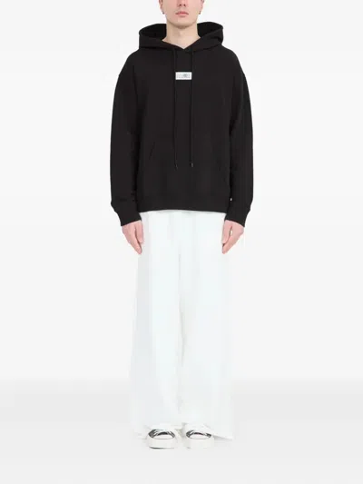 Mm6 Maison Margiela Mm6 By Maison Margiela Emblazoned Black Hoodie With Drawstring And Ribbed Finishes In Black