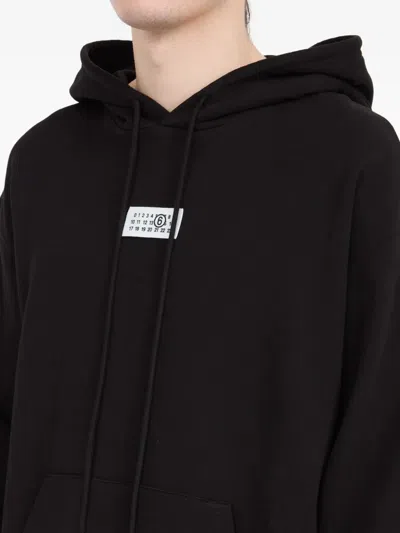 Mm6 Maison Margiela Mm6 By Maison Margiela Emblazoned Black Hoodie With Drawstring And Ribbed Finishes In Black