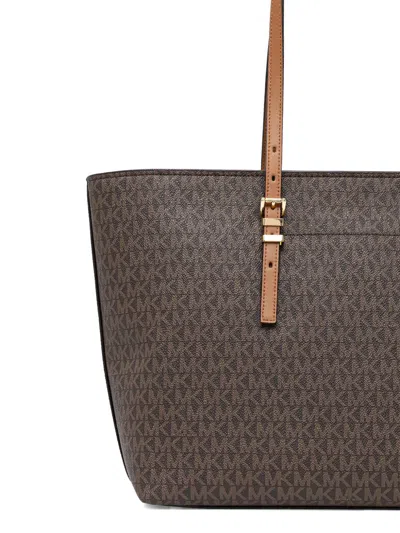 Michael Kors Monogrammed Tote Bag With Adjustable Straps And Gold-tone Hardware In Brown