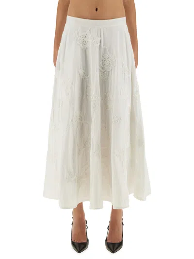 Rotate Birger Christensen Floral Embroidered A-line Midi Skirt In Organic Cotton In White