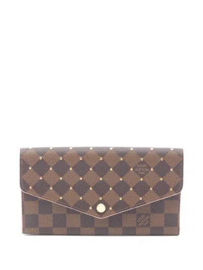 Pre-owned Louis Vuitton 2019 Sara Damier-pattern Stud Wallet In Brown