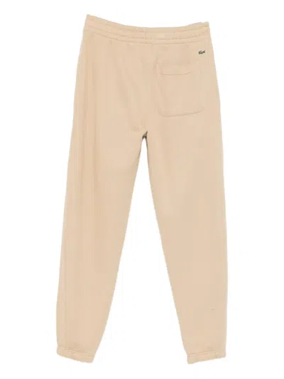Lacoste Logo-debossed Track Pants In Neutral