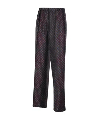 Dries Van Noten Patterned Elastic Waistband Relaxed Fit Trousers In Black