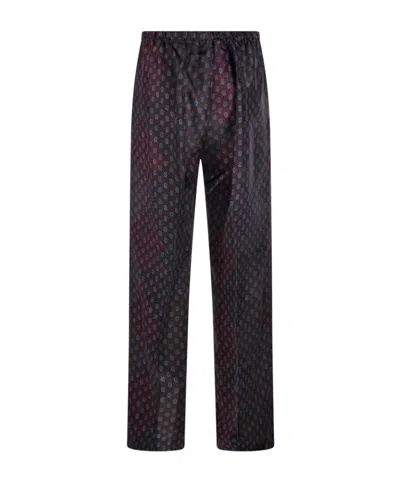 Dries Van Noten Patterned Elastic Waistband Relaxed Fit Trousers In Black