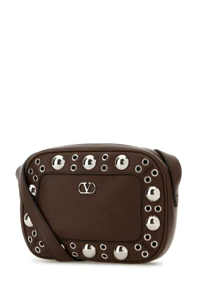 Valentino Garavani Dome-shaped Crossbody Bag With Metallic Eyelets And Adjustable Strap In Brown