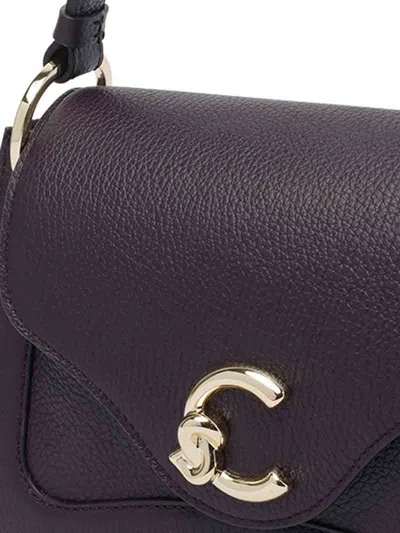 Coccinelle Pebbled Leather Shoulder Bag In Purple