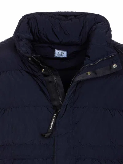 C.p. Company Blue Down Jacket With Fixed Hood And Logo Plaque On The Sleeve In Tech Fabric Man In Blue