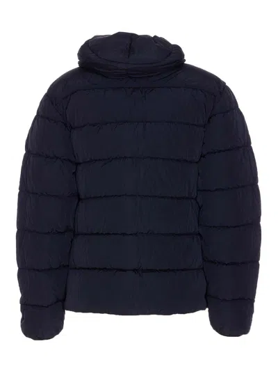 C.p. Company Blue Down Jacket With Fixed Hood And Logo Plaque On The Sleeve In Tech Fabric Man In Blue