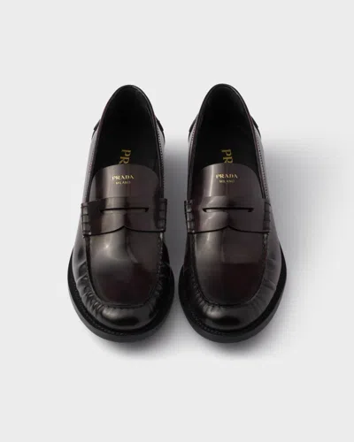 Prada Leather Ruched Penny Loafers In Brown