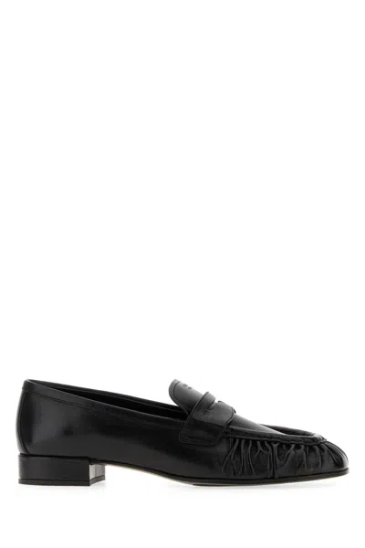 Prada Rounded Toe Loafers With Textured Detailing And Low Block Heel In Black