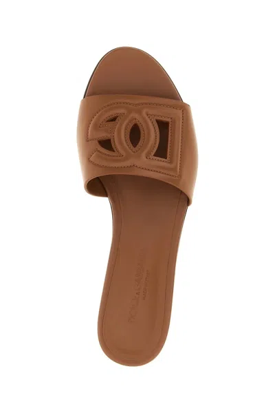 Dolce & Gabbana Leather Slides With Cut-out Logo In Brown