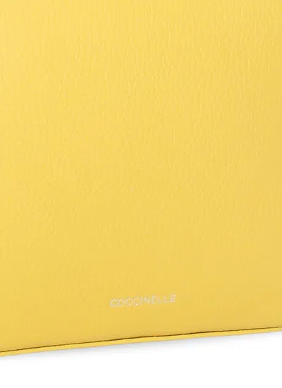 Coccinelle Tebe Logo Printed Small Shoulder Bag In Yellow