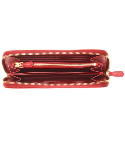 Shop Prada Saffiano Leather Zip-around Wallet In Fuoco